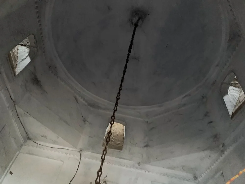 Domed ceiling of garbhagriha with clerestory windows